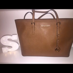 MK Jet Set Travel Medium Top-zip tote.